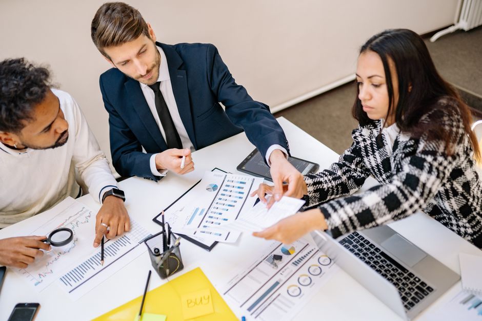 A data team reviewing dashboards and charts together