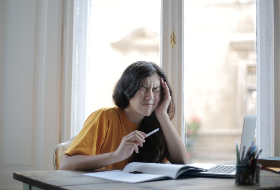 A learner working through a course module on a laptop